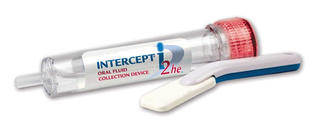 A tube of intercept 2 he toothpaste next to a toothbrush.