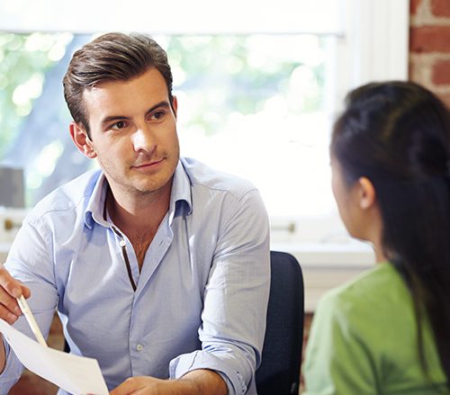 A man and woman are talking to each other.