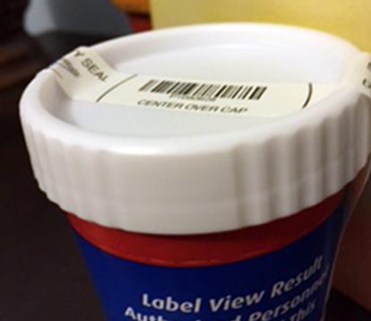 A cup of coffee with a label on it.