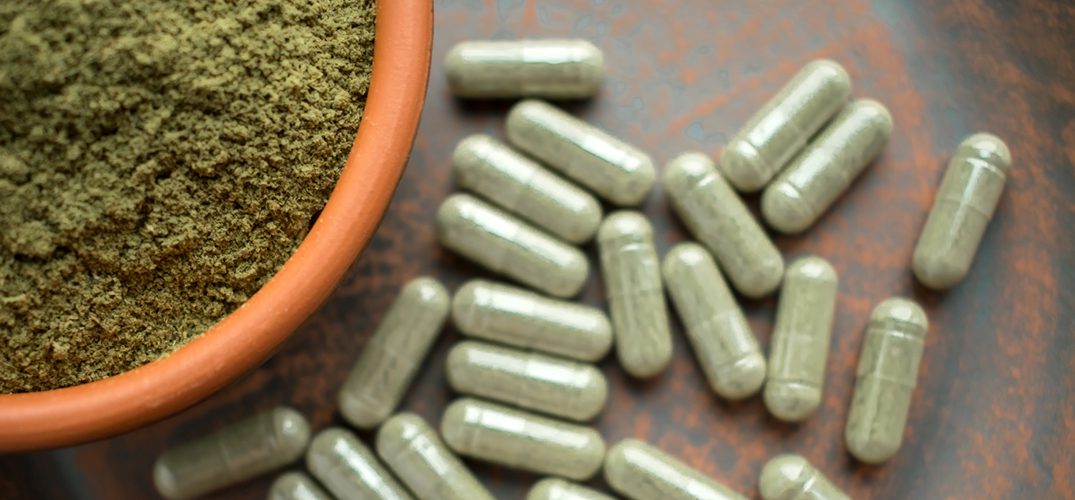 A bowl of powder and some pills on the table