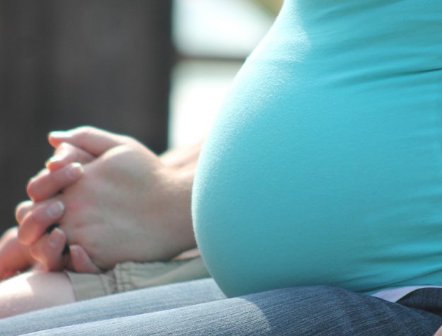 A close up of the belly of a pregnant woman
