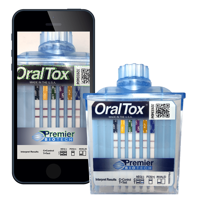 A phone and some tubes of tooth paste