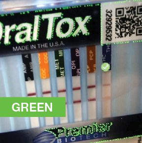 A green box with the words " oraltox " on it.