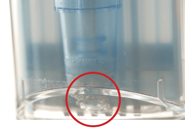 A close up of a cup with a red circle around it