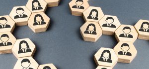 A table with wooden blocks that have people on them.