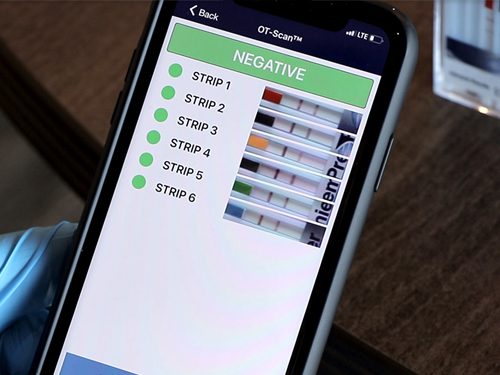 A cell phone with the negative screen on.