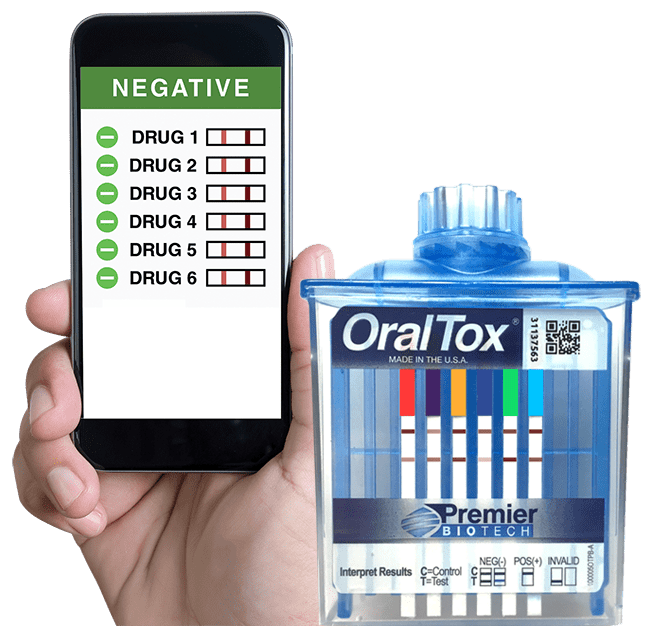 A person holding an iphone and a container of oral tox.