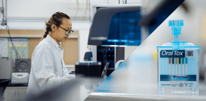 A man sitting at a desk in front of a computer.