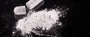 A pile of white powder sitting on top of a table.